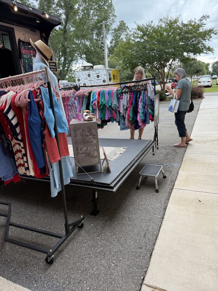outside vendors and shoppers enjoying food truck fare