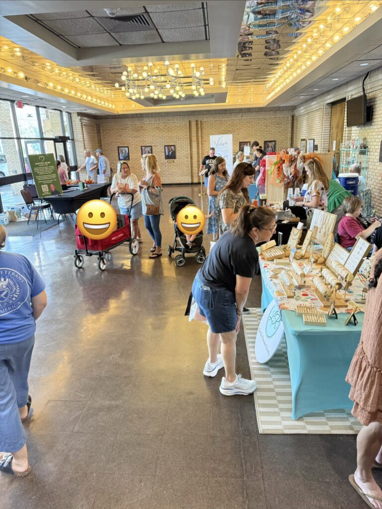 shoppers and vendors in the lobby of Fairhope Civic Center
